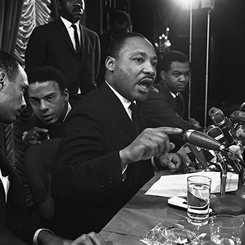 Martin Luther King with Andrew Young and Al Raby at press conference at Sahara Hotel Chicago, IL. King announces the Open City campaign to fight problems of the poor in the North. This is the SCLC’s first true Northern campaign. Jan. 7, 1966